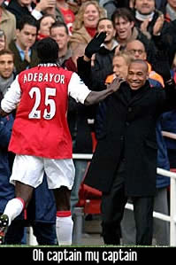 Adebayor celebrates with Thierry Henry