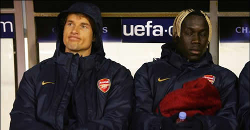 Jens Lehmann and Bacary Sagna try to contain their excitement...