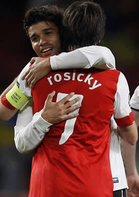 Eduardo and Rosisky embrace after Arsenal's 5-1 Champions League win